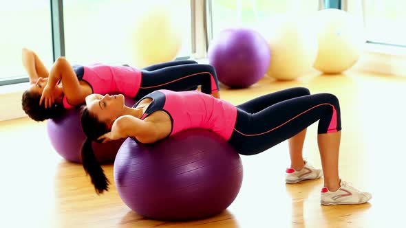 Attractive Slender Women Doing Sports Exercise Using Fitness Balls
