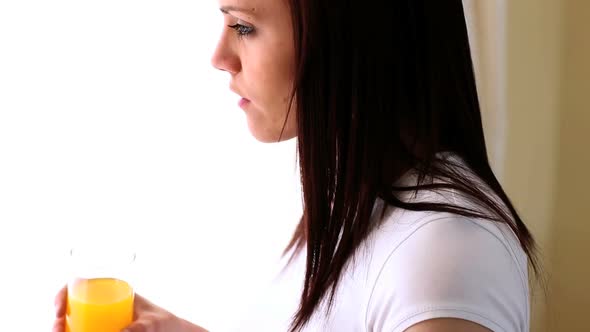 Attractive Woman Drinking Orange Juice