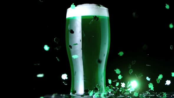 Shamrock Confetti Next To A Pint Of Green Beer