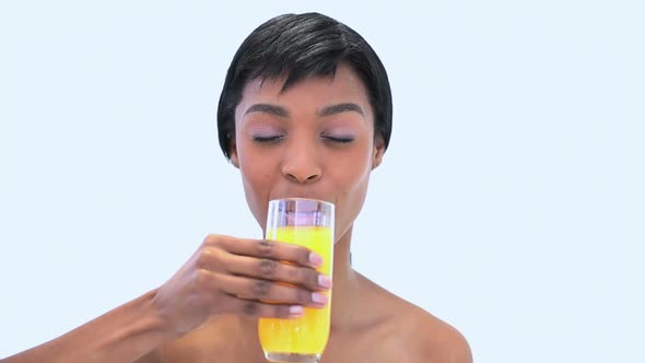 Attractive Woman Holding A Glass Of Orange Juice alt
