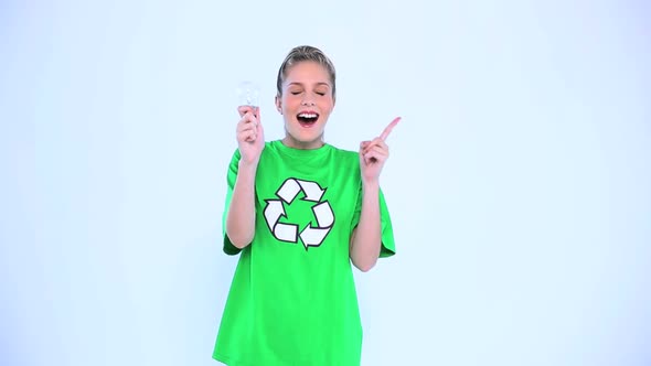 Thoughtful Environmental Activist Holding A Light Bulb