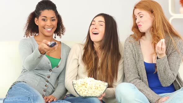 Three Friends Watching Television