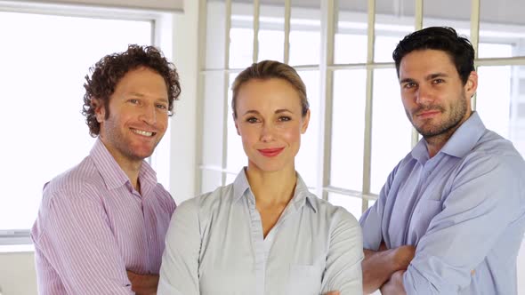 Confident Businesspeople Posing With Arms Crossed alt
