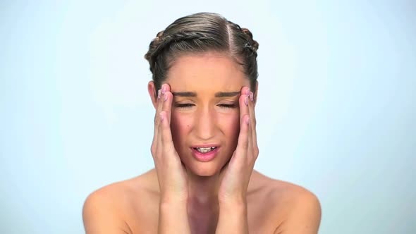 Nervous Young Woman Put Her Hands On Temples alt