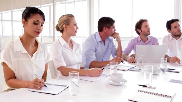 Business Team Working Together On A Problem alt