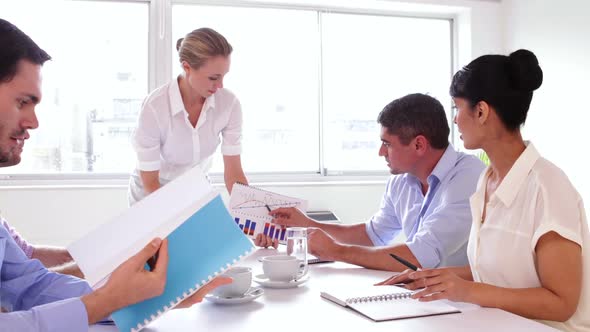 Business Team Working Together Sitting At A Table alt