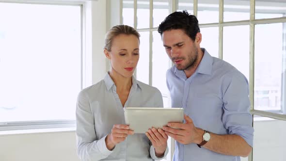 Content Colleagues Working Together With Tablet alt