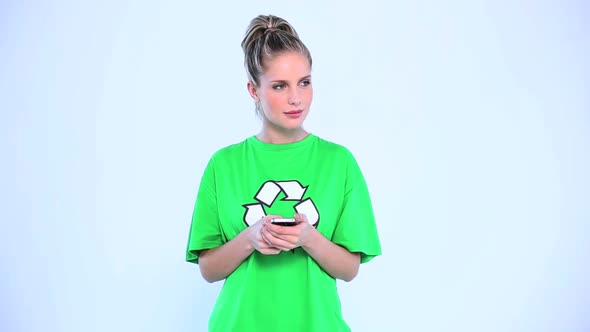 Attractive Woman Wearing A Green Tshirt With Recycling Symbol On It