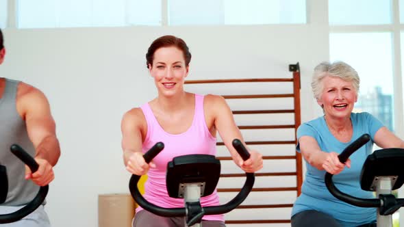 Happy Diverse Fitness Group Doing A Spinning Class