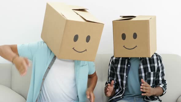 Silly Employees With Boxes On Their Heads Doing The Robot