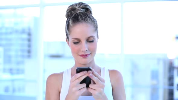 Beautiful Businesswoman Texting With Her Mobile Phone alt