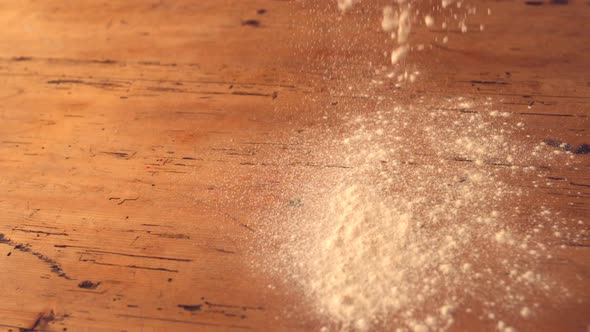 Flour Sprinkled Onto Wooden Work Surface