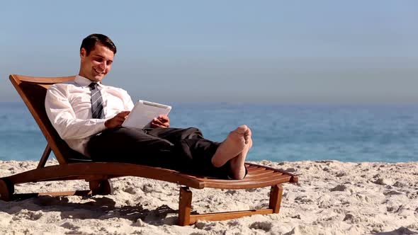Businessman Lying On The Beach alt