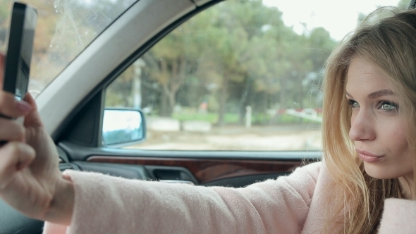 Dumb Blonde Photographing Themselves In The Car