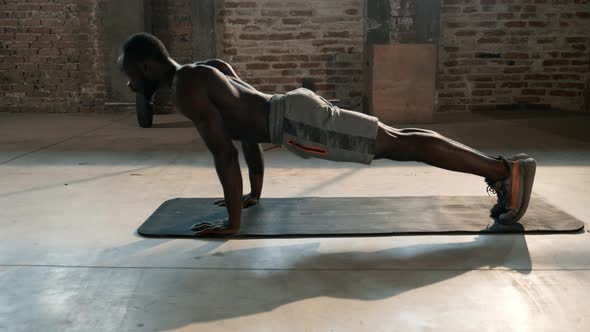 Exercise. Sport man working out in gym, doing push-up