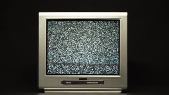 Turning Off Retro Oldfashioned Television on Black Background