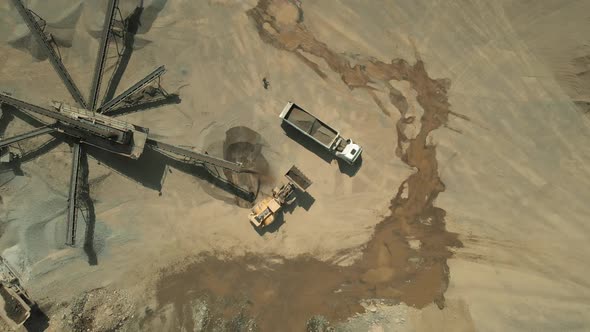 Aerial View of Heavy Machinery Working at Quarry