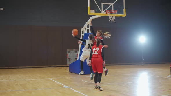 Training Basketball Game Female Player Successfully Scores the Ball in the Basket the Confrontation