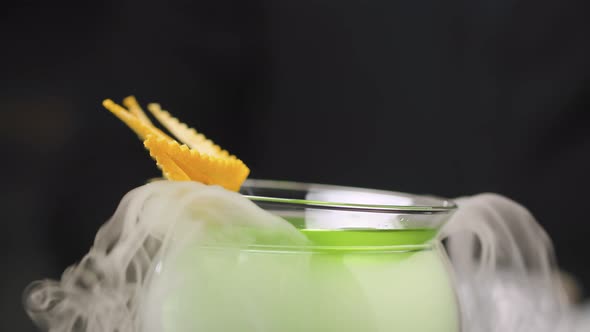 Grape Martini Cocktail Cooling in a Bowl with Dry Ice