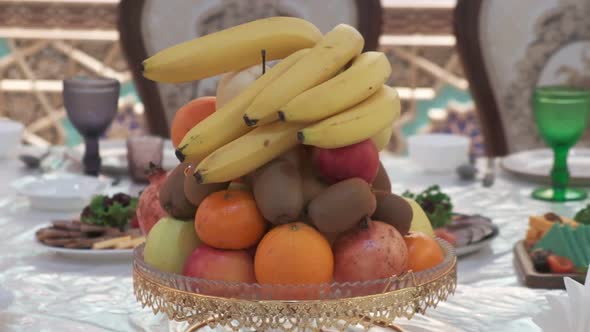 Closeup of Yellow Green and Red Colored Cheese with Greens Nuts Dried Fruits