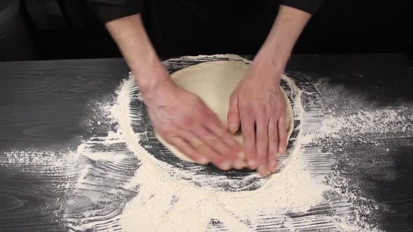 Stretching Raw Pizza Dough with your Hands