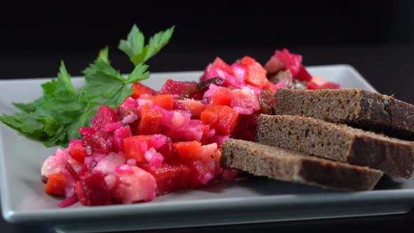 Salad from boiled vegetables, beetroot, carrot, potatoes, cucumber, rotates