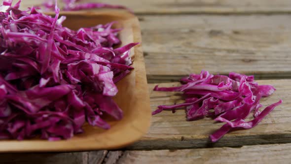 Shredded cabbage in wooden bowl 4k