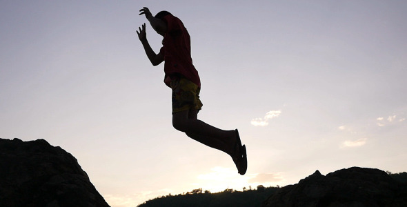 Kid Jumping Over Rocks alt