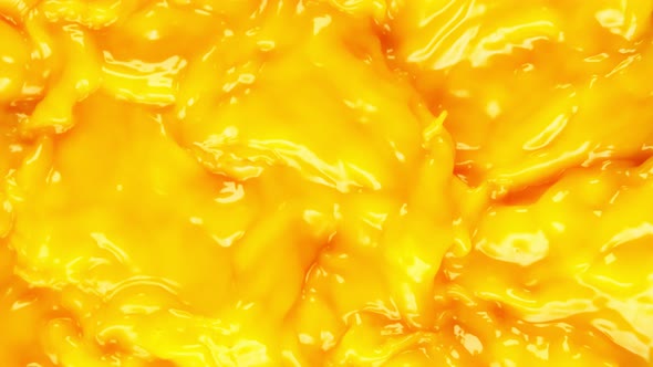 Super Slow Motion Shot of Swirling Orange Juice at 1000 Fps.