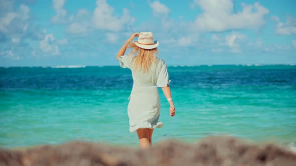 Tanned Girl In Dress Relaxing On Vacation. Woman Standing On Tropical Hawaii Beach.