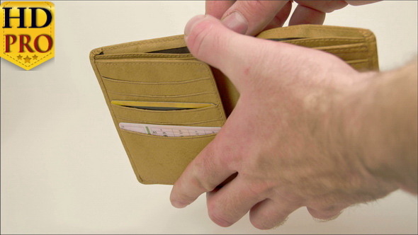 A Hand Opening a Wallet with Euro Bills