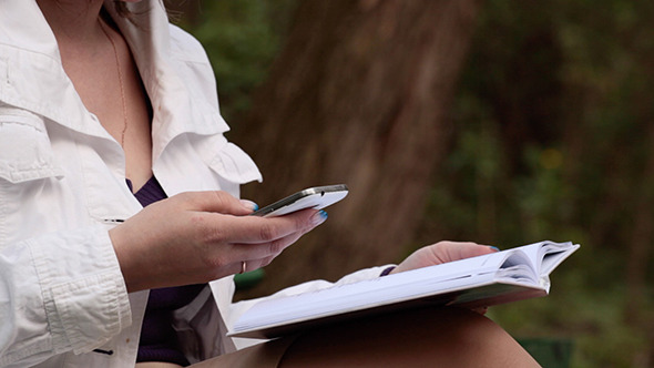 Girl Typing On A Mobile Phone