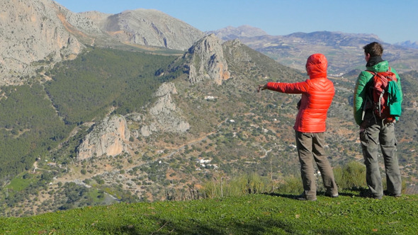 Young Couple Hiking the Mountain alt