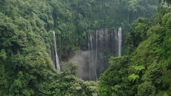 A flight to the waterfall through a canyon