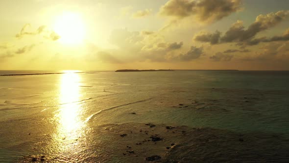 Aerial top down sky of tropical coastline beach holiday by blue water with white sandy background of