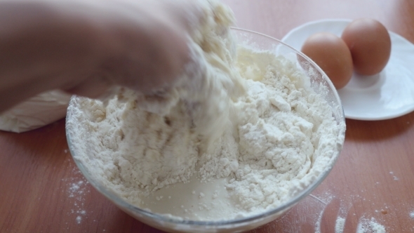 Preparing Dough, Hands Mixing Ingredients. 