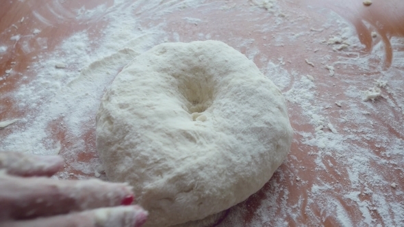 Pour Olive Oil On Dough. 