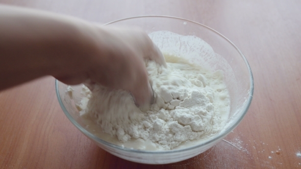 Put The Flour In Bowl And Hands Mixing Fresh Dough