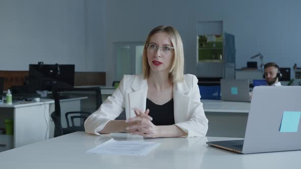 Smiled Woman Glad to Do Her Work in a Company