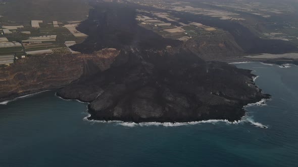 Impressive view solidified lava flow in sea after Cumbre Vieja volcano eruption at La Palma island.