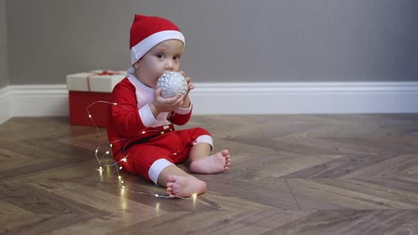 Baby Infant Kid Red Santa Costume Hat Plying Christmas Lights Wooden Floor Home
