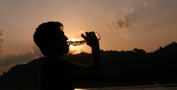 Man Drinking Water From A Bottle