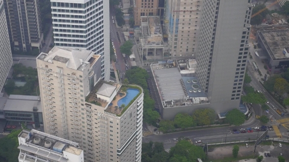 Top View On Roof Pool And City With Buildings And