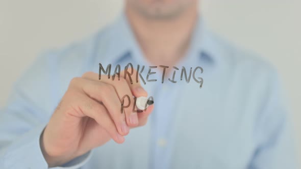 Marketing Plan, Man Writing on Transparent Glass Screen