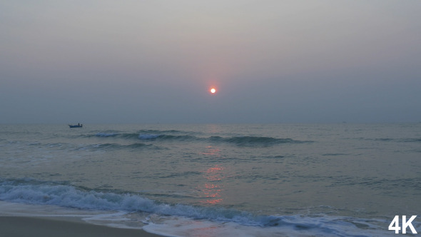 Sunrise With Sea Waves On The Beach