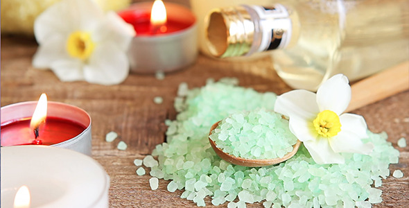 Close-Up of Spa Salt Scrub Massage Oil and Candles