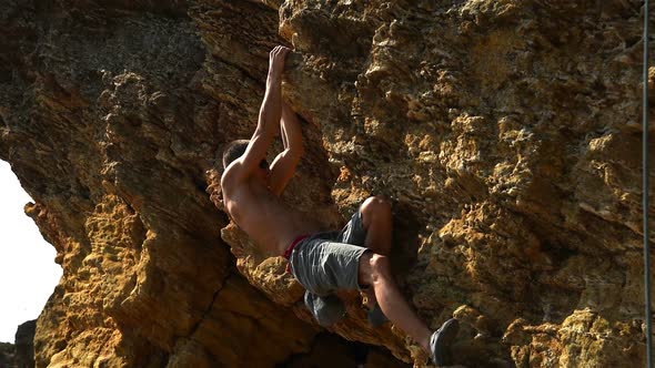 Climber Climbing On A Rock