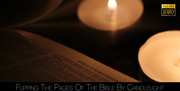 Flipping The Pages Of The Bible By Candlelight