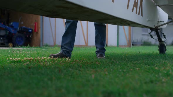 Pilot Legs Walking Grass Near Plane Ready Flight