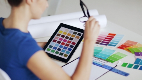Woman With Tablet Pc Choosing Color From Palette